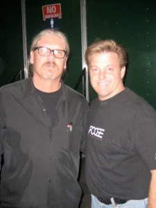 2 men wearing black shirts