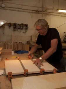 Man building guitars