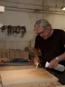 Man building guitars