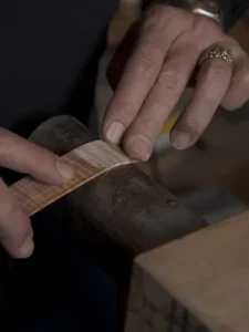 Man building guitars