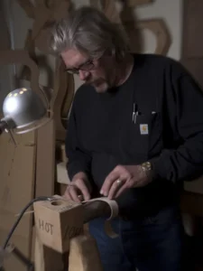 Man building guitars