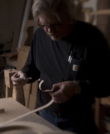 Man making a guitar