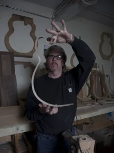 Man building guitars